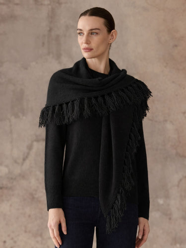 Front view of the Jet Black cashmere sweater with its matching fringed scarf draped across the shoulders, worn with dark denim.