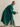Three-quarter side view of the Emerald Green cashmere wrap coat, showing the loose silhouette, wide sleeve and belt hanging at the side.