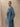 Closer three-quarter view of the Classic Cashmere Wrap Coat in Powder Blue, showing the notched lapels and generous sleeves.