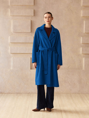 Full-length front view of the Royal Blue Classic Cashmere Wrap Coat, belted over a burgundy sweater and dark wide-leg denim.