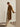 Side view of the Classic Cashmere Wrap Coat in Warm Camel, worn open to show the generous sleeves and straight silhouette.