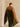 Back view of the colorblock cashmere travel wrap, showing the Deep Chestnut upper panel, Olive lower panel and contrast trim at the ends.