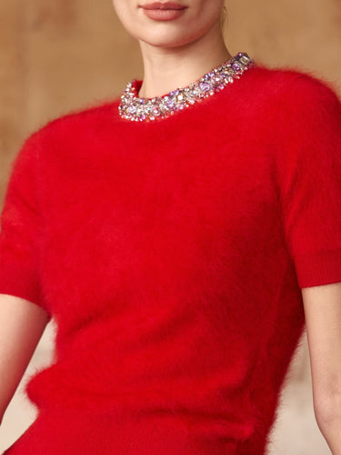 Close-up of the jeweled crew neckline and soft brushed texture on the Ruby Red short-sleeve cashmere sweater.