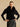 Front view of the Jet Black cashmere jacket with the model’s hands at her waist, showing the full fur collar and curved front edges.