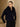 Model wearing the Midnight Navy short-sleeve cashmere jacket with fur collar over a black long-sleeve top, front view.