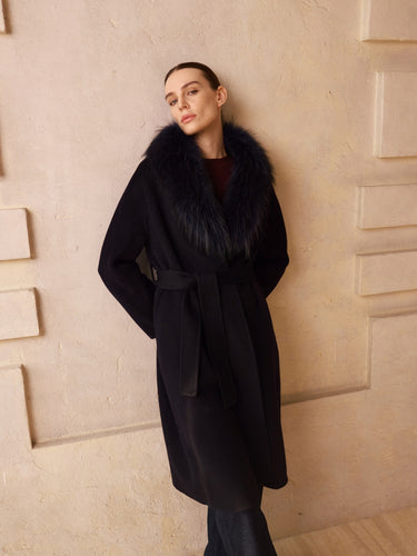 Front view of the Deep Navy Signature Cashmere Wrap Coat with fur collar and self-tie belt, worn over dark denim.