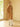 Full-length side view of the Warm Camel Signature Cashmere Wrap Coat with fur collar, worn open with the belt hanging loosely.