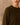 Close-up of a model wearing an olive crewneck sweater, showing the fine knit texture and ribbed neckline.
