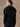Back view of the Jet Black cashmere sweater, with the matching scarf draped into a fringed point across the shoulders.