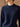 Close front view of the Midnight Navy Donegal cashmere sweater, showing the crew neckline, color flecks and ribbed shoulder detailing.