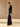 Full-length side view of the Midnight Navy Donegal cashmere crewneck sweater, showing its hip-length fit over dark denim.