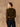 Back view of the Classic Cashmere Crewneck Sweater in Olive, showing its gently skimming silhouette and long sleeves.