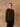 Front view of the Classic Cashmere Crewneck Sweater in Olive, showing its long sleeves and hip-length fit over dark denim.