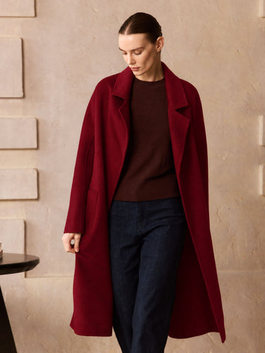 Front view of the Deep Burgundy Classic Cashmere Wrap Coat, worn open to show its notched lapels, generous sleeves and straight silhouette.