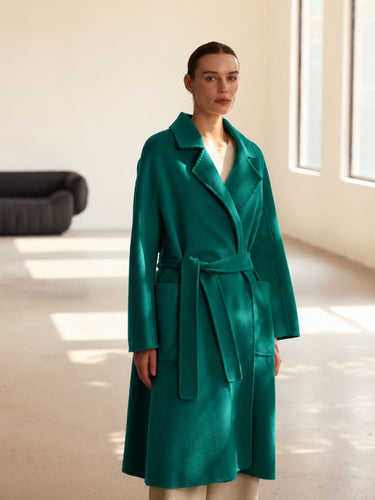 Front view of the Emerald Green cashmere wrap coat, showing the notched lapels, self-tie belt and generous sleeves.