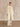 Full-length front view of the Classic Cashmere Wrap Coat in Ivory, worn open over tonal knitwear and wide-leg trousers.