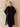 Model wearing the Classic Cashmere Wrap Coat in Jet Black open over a burgundy sweater and dark denim, front view.
