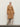 Full-length front view of the Classic Cashmere Wrap Coat in Warm Camel, tied at the waist over ivory wide-leg trousers.