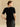Back view of the Midnight Noir short-sleeve cashmere sweater, showing the jeweled neckline and small keyhole opening.
