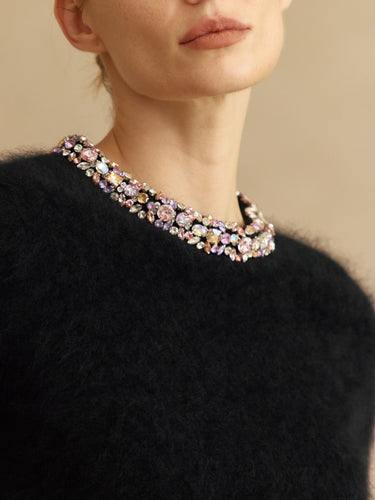 Close-up of the multicolored jeweled crew neckline and soft brushed texture on the Midnight Noir cashmere sweater.