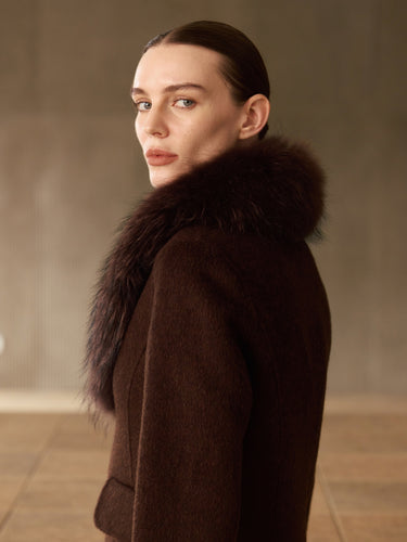 Close side view of the Chocolate Brown long cashmere coat, showing the full fur collar and shoulder.