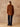Full-length back view of the Camel side of the Reversible Cashmere Car Coat, styled with dark denim and brown boots.