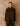 Front view of the Reversible Cashmere Car Coat worn on the Soft Sage side, showing the point collar and button front over dark denim.