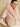 Front view of the Blush short-sleeve cashmere jacket with fur collar, layered over an ivory long-sleeve knit.