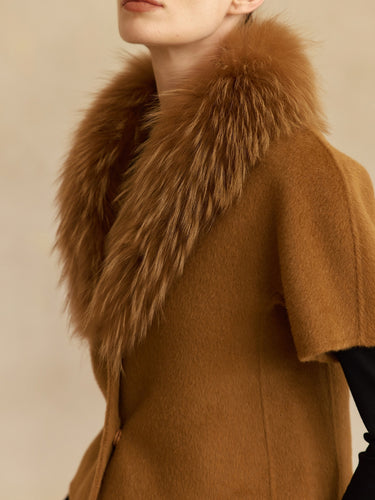 Close-up of the Camel cashmere jacket, showing the matching fur collar, short sleeve and rounded front edge.