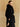 Three-quarter back view of the Jet Black Signature Cashmere Wrap Coat, showing the fur collar and belted waist.