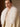 Close-up of the white fur collar framing the neckline of the Soft Ecru Signature Cashmere Wrap Coat.