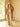 Full-length front view of the Warm Camel Signature Cashmere Wrap Coat with fur collar, worn open over ivory knitwear and wide-leg trousers.